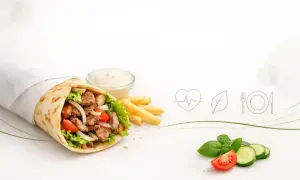 Pyszny kebab w tortilli z frytkami i sosem. Zastanawiasz się, ile kalorii ma kebab box z frytkami?
